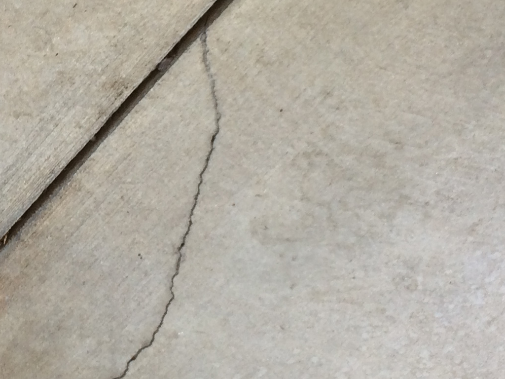 crack in concrete with control joint